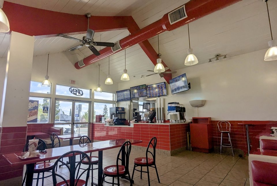 Drive-in restaurant exterior with parking spaces